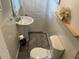 Neat bathroom featuring a pedestal sink, a toilet, and decorative accents with black and white geometric rug at 514 Palm St., Georgetown, SC 29440
