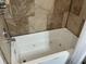 Elegant bathroom with a relaxing jacuzzi tub, tiled walls, and modern fixtures at 514 Palm St., Georgetown, SC 29440