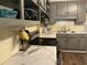 Close-up view of a kitchen, showcasing stainless steel appliances, stylish countertops, and tile backsplash at 514 Palm St., Georgetown, SC 29440