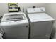 Laundry room showcasing a white washer and dryer, a laundry sign, and necessary utility connections at 514 Palm St., Georgetown, SC 29440