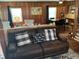 Comfortable living room with a leather couch and view into the dining area and kitchen at 514 Palm St., Georgetown, SC 29440