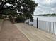 Inviting waterfront deck and brick walkway offer stunning water views and outdoor relaxation at 514 Palm St., Georgetown, SC 29440