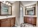 Bathroom features double sinks, framed mirrors, and neutral finishes at 5153 Country Pine Dr., Myrtle Beach, SC 29579