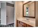 Bathroom featuring a vanity with storage, framed mirror and white door at 5153 Country Pine Dr., Myrtle Beach, SC 29579