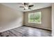 Bedroom with gray wood floors, ceiling fan, neutral walls, and window at 5153 Country Pine Dr., Myrtle Beach, SC 29579
