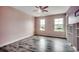 Bedroom features hardwood floors, natural light, and views of the yard at 5153 Country Pine Dr., Myrtle Beach, SC 29579