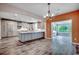 Spacious kitchen features a large island with gray cabinets and modern appliances at 5153 Country Pine Dr., Myrtle Beach, SC 29579