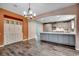 Well-lit kitchen boasts an island, gray cabinets, and stainless steel appliances at 5153 Country Pine Dr., Myrtle Beach, SC 29579