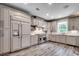 Modern kitchen featuring gray cabinets, stainless steel appliances, and plenty of counter space at 5153 Country Pine Dr., Myrtle Beach, SC 29579
