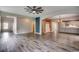 Open-concept living area boasts hardwood floors connecting to kitchen and dining at 5153 Country Pine Dr., Myrtle Beach, SC 29579