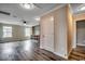 Open-concept living room with hardwood flooring, a ceiling fan, recessed lighting, and built-in shelving at 5153 Country Pine Dr., Myrtle Beach, SC 29579