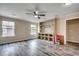 Open-concept living room with hardwood flooring, a ceiling fan, recessed lighting, and built-in shelving at 5153 Country Pine Dr., Myrtle Beach, SC 29579