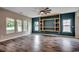Bright living room with wood floors, built-in shelving, and lots of light at 5153 Country Pine Dr., Myrtle Beach, SC 29579