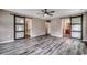 Spacious bedroom with barn doors, hardwood floors, and neutral paint at 5153 Country Pine Dr., Myrtle Beach, SC 29579