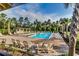 Stunning community pool surrounded by lush landscaping and plenty of lounge chairs at 5153 Country Pine Dr., Myrtle Beach, SC 29579