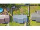Aerial view of the home showcasing its metal roof, fenced backyard, and proximity to neighboring properties in a suburban setting at 517 Cardinal Dr., Conway, SC 29526