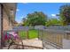 Back deck features a lounge chair, privacy fence, and grass yard for outdoor enjoyment at 517 Cardinal Dr., Conway, SC 29526