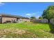 Spacious backyard shows a brick house, metal shed, and green grass area for activities at 517 Cardinal Dr., Conway, SC 29526