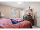 Bedroom featuring neutral paint, a ceiling fan, and a view of the backyard at 517 Cardinal Dr., Conway, SC 29526