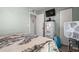 Bedroom boasts a white dresser, neutral walls, and a mounted TV, blending comfort and functionality at 517 Cardinal Dr., Conway, SC 29526