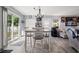 Dining area featuring a dining table, modern light fixture, and sliding glass doors to the backyard at 517 Cardinal Dr., Conway, SC 29526