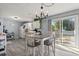 Dining area featuring a dining table, modern light fixture, and sliding glass doors to the backyard at 517 Cardinal Dr., Conway, SC 29526