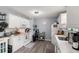 Bright kitchen featuring white cabinets, neutral countertops, and modern appliances at 517 Cardinal Dr., Conway, SC 29526