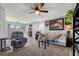 Cozy living room featuring neutral paint, natural light, ceiling fan, and comfortable furnishings at 517 Cardinal Dr., Conway, SC 29526