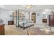 Bedroom featuring a four-poster bed, sitting area, and ensuite bathroom at 5407 N Ocean Blvd., Myrtle Beach, SC 29577