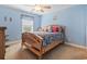 Vibrant blue bedroom with surfboard themed bedding and a cozy atmosphere at 5407 N Ocean Blvd., Myrtle Beach, SC 29577