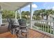 Charming front porch with outdoor seating and white railing detail at 5407 N Ocean Blvd., Myrtle Beach, SC 29577