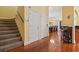 Bright hallway featuring hardwood floors, a staircase, and easy access to the dining room at 5407 N Ocean Blvd., Myrtle Beach, SC 29577