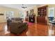 Cozy living room featuring a fireplace, built-in shelves, hardwood floors, and comfortable seating at 5407 N Ocean Blvd., Myrtle Beach, SC 29577