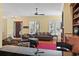 Open living room features hardwood floors, a ceiling fan, and a cozy seating arrangement at 5407 N Ocean Blvd., Myrtle Beach, SC 29577