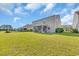 Well-maintained backyard features a screened porch and spacious lawn at 5621 Camilla Ct., Myrtle Beach, SC 29579