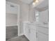 Bathroom featuring a dual sink vanity with cabinets, a large mirror, and tile flooring at 5621 Camilla Ct., Myrtle Beach, SC 29579