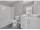 Well-lit bathroom featuring a tub, toilet, and sink with cabinets that provide sufficient storage at 5621 Camilla Ct., Myrtle Beach, SC 29579