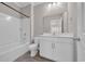 Bright bathroom featuring a shower-tub combination and a vanity with a white countertop at 5621 Camilla Ct., Myrtle Beach, SC 29579