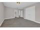 Comfortable bedroom featuring soft carpeting, double closet doors, and easy access to the ensuite bathroom at 5621 Camilla Ct., Myrtle Beach, SC 29579