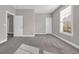 Well-lit bedroom with plush gray carpet and two closets, providing a comfortable space at 5621 Camilla Ct., Myrtle Beach, SC 29579