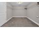 Walk-in closet providing ample storage space, complete with shelving and carpeted flooring at 5621 Camilla Ct., Myrtle Beach, SC 29579