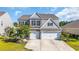 Charming two-story home with a brick and siding exterior and a spacious three-car garage at 5621 Camilla Ct., Myrtle Beach, SC 29579