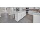 Modern kitchen with island, stainless steel appliances and stone backsplash at 5621 Camilla Ct., Myrtle Beach, SC 29579