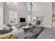 Bright living room featuring high ceilings, large windows, and open layout connecting to dining area at 5621 Camilla Ct., Myrtle Beach, SC 29579