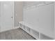 Functional mudroom with built-in bench and cubbies for storage, seamlessly integrating style and utility at 5621 Camilla Ct., Myrtle Beach, SC 29579