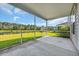Screened porch overlooking serene backyard with trees and pond at 5621 Camilla Ct., Myrtle Beach, SC 29579