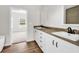 Elegant bathroom with dual sinks, wood-look countertops, and a view into the bedroom, blending comfort and luxury at 565 Kent Rd., Georgetown, SC 29440