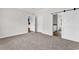 Inviting bedroom showcasing neutral walls, plush carpet, and a barn door leading to the connected bathroom at 565 Kent Rd., Georgetown, SC 29440