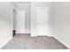 Bedroom featuring carpeted floors and multiple white doors at 565 Kent Rd., Georgetown, SC 29440