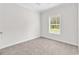Neutral bedroom featuring carpeted floors and a window with blinds at 565 Kent Rd., Georgetown, SC 29440